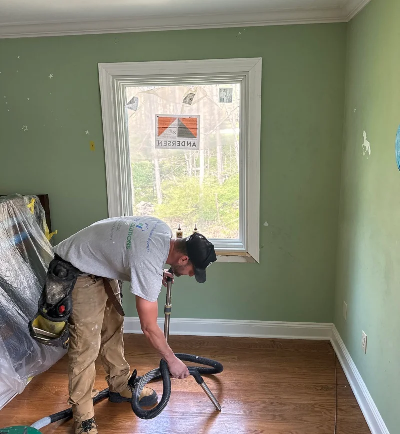 Using a HEPA vac to clean this window installation jobsite
